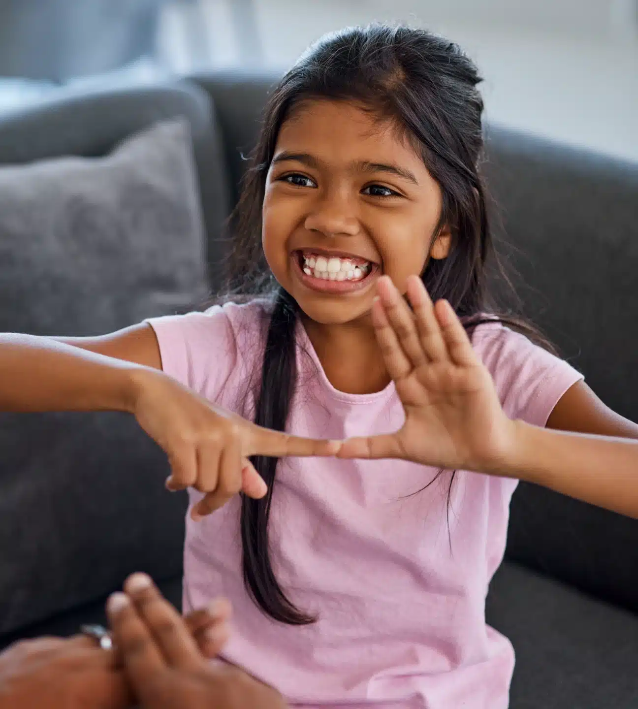 A child communicating in sign language